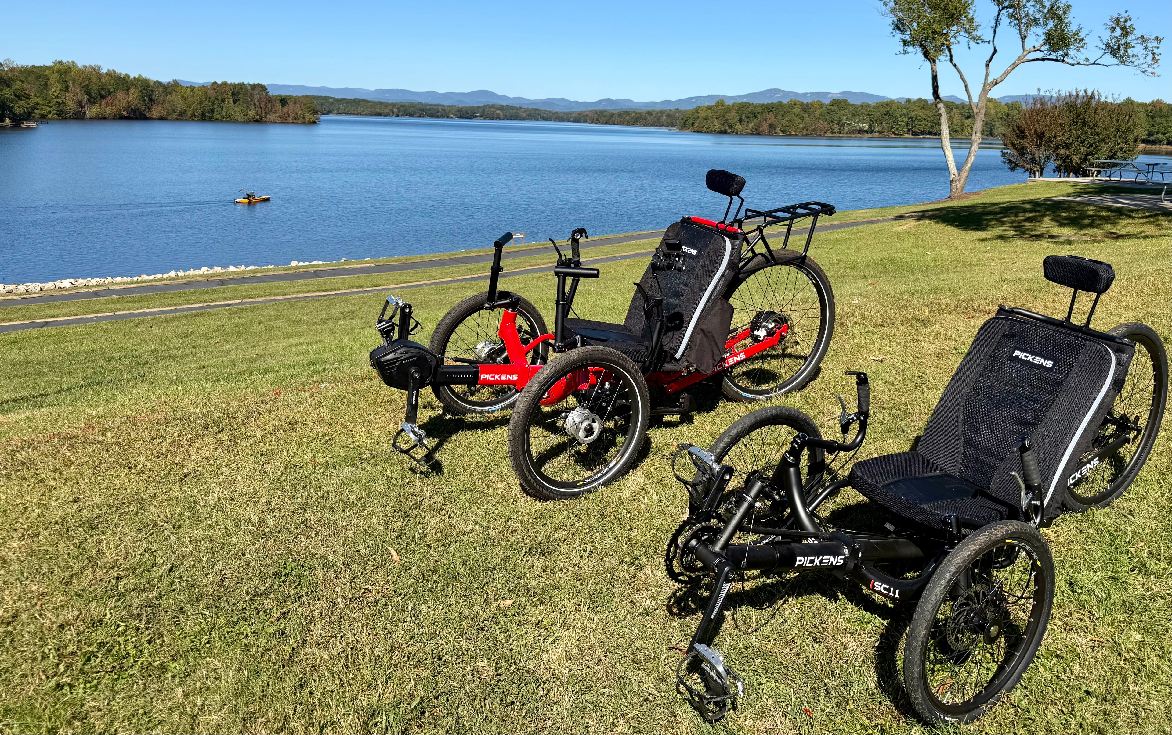 Rider on a recumbent trike traveling along a mountain road