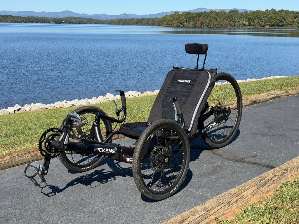Pickens Cycles recumbent trikes at a mountain overlook.